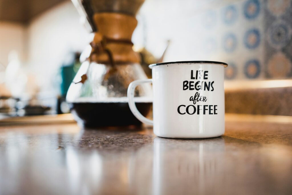coffee cup on a countertop in the morning. 